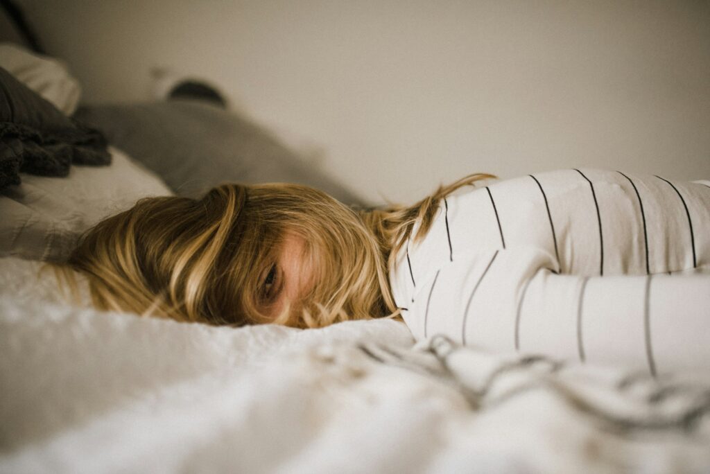 a woman lying on a bed